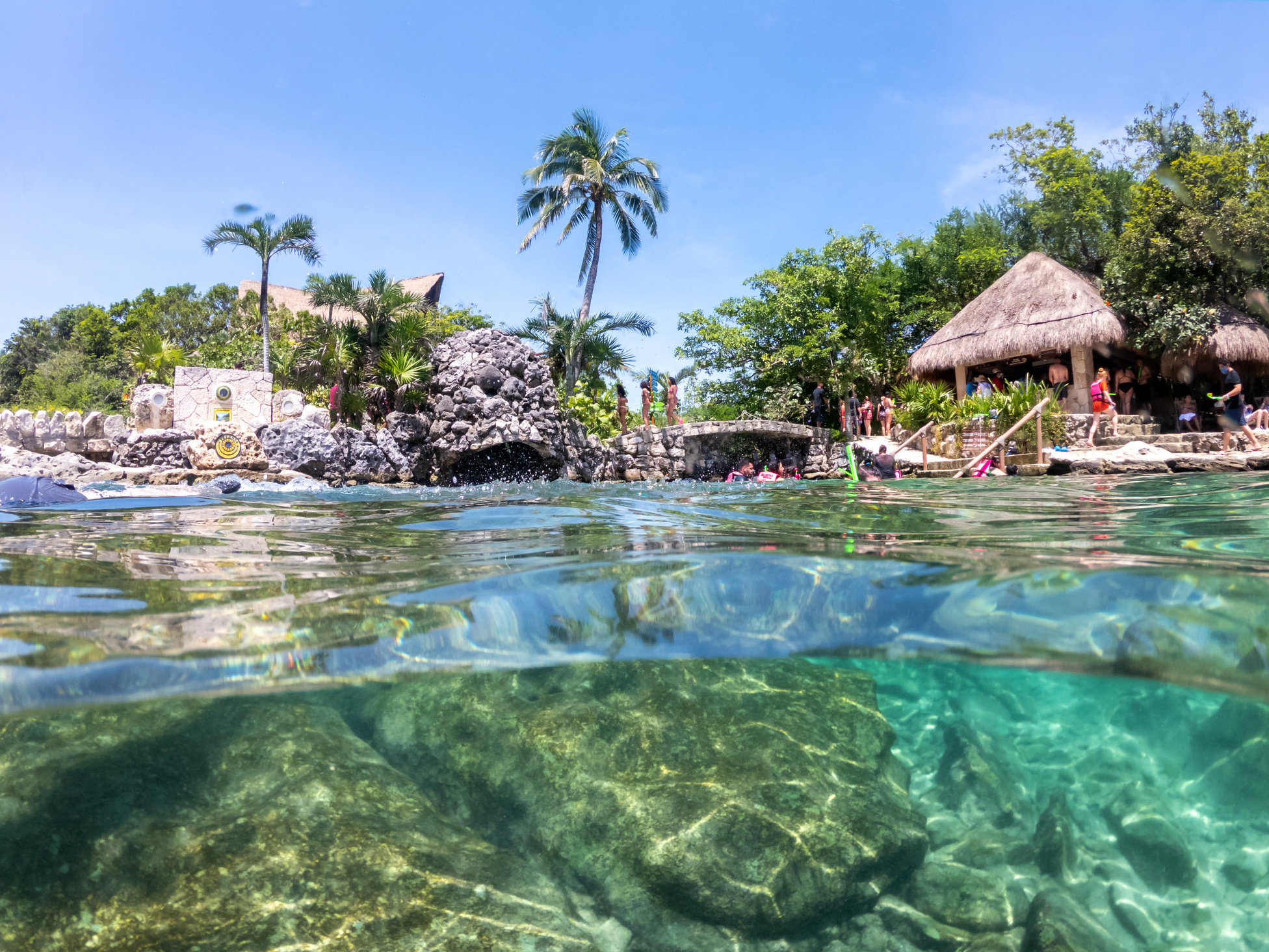 Cancun, Mexico - September 13, 2021: Split Underwater View in Snorkeling Lagoon at XCaret Park on the Mayan Riviera Resort. XCaret Is a Famous Ecotourism Park on the Mexican Mayan Riviera